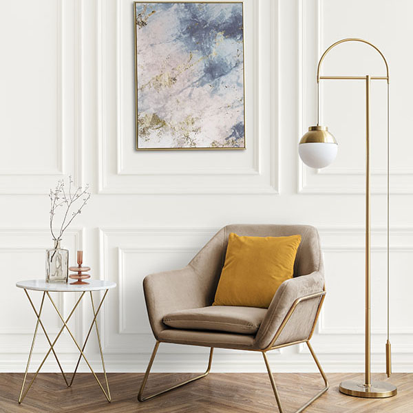 Picture frame by a velvet armchair